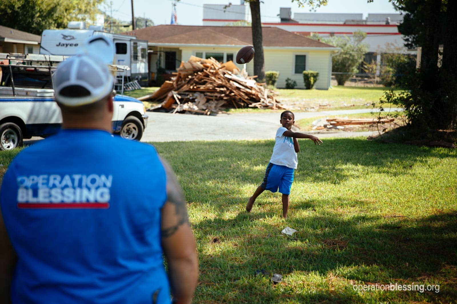 An OB worker plays with and encourages Debra's grandson.